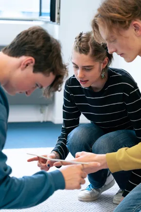 Several students discuss a topic.